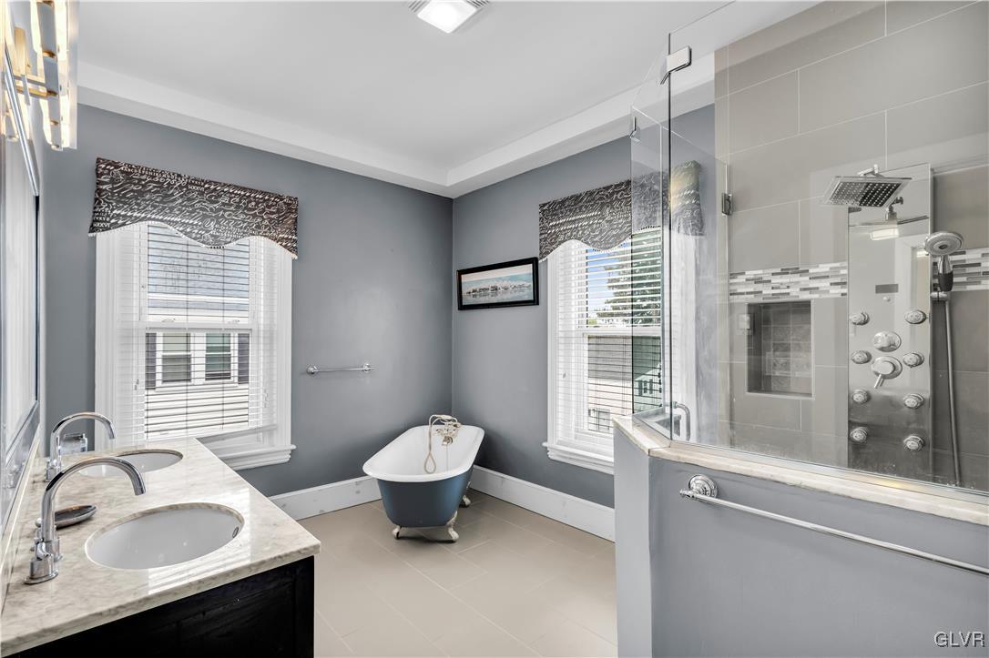 426 3rd Avenue Bethlehem, PA 18018 - Photo 22 of 45 a bathroom with a sink toilet a mirror and next to a window