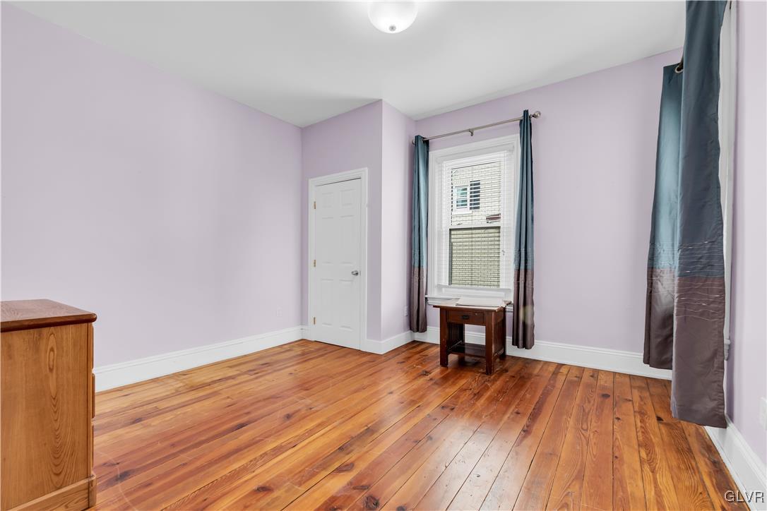 426 3rd Avenue Bethlehem, PA 18018 - Photo 24 of 45 a view of a livingroom with wooden floor and a window