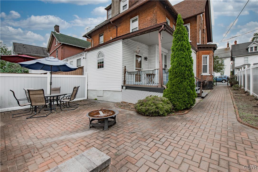 426 3rd Avenue Bethlehem, PA 18018 - Photo 37 of 45 a backyard of a house with lawn chairs and a barbeque