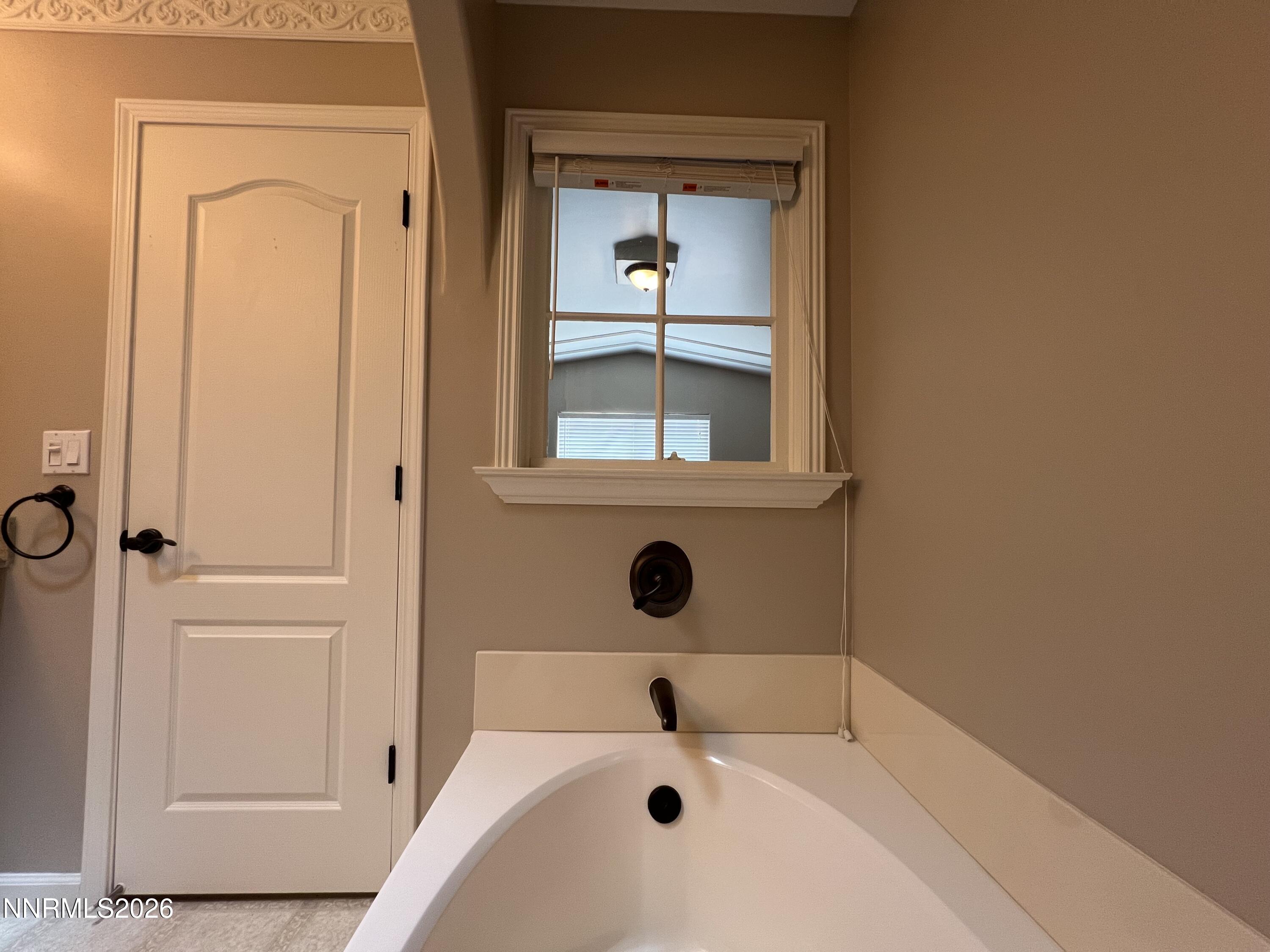 18406 Teddy Bear Court Reno, NV 89508 - Photo 18 of 44 a bathroom with a tub