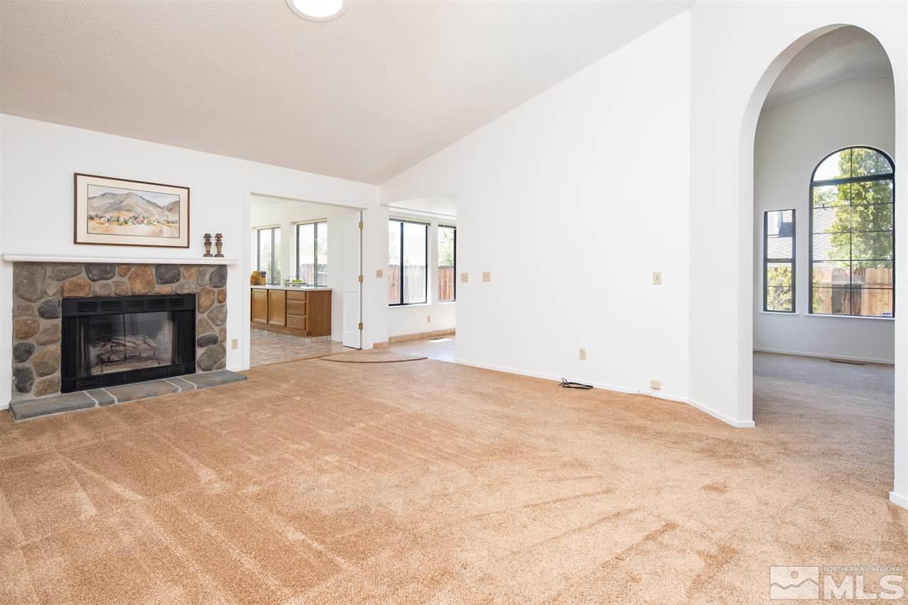 5310 Vista Ridge Way Reno, NV 89523 - Photo 6 of 25 an empty room with windows and fireplace