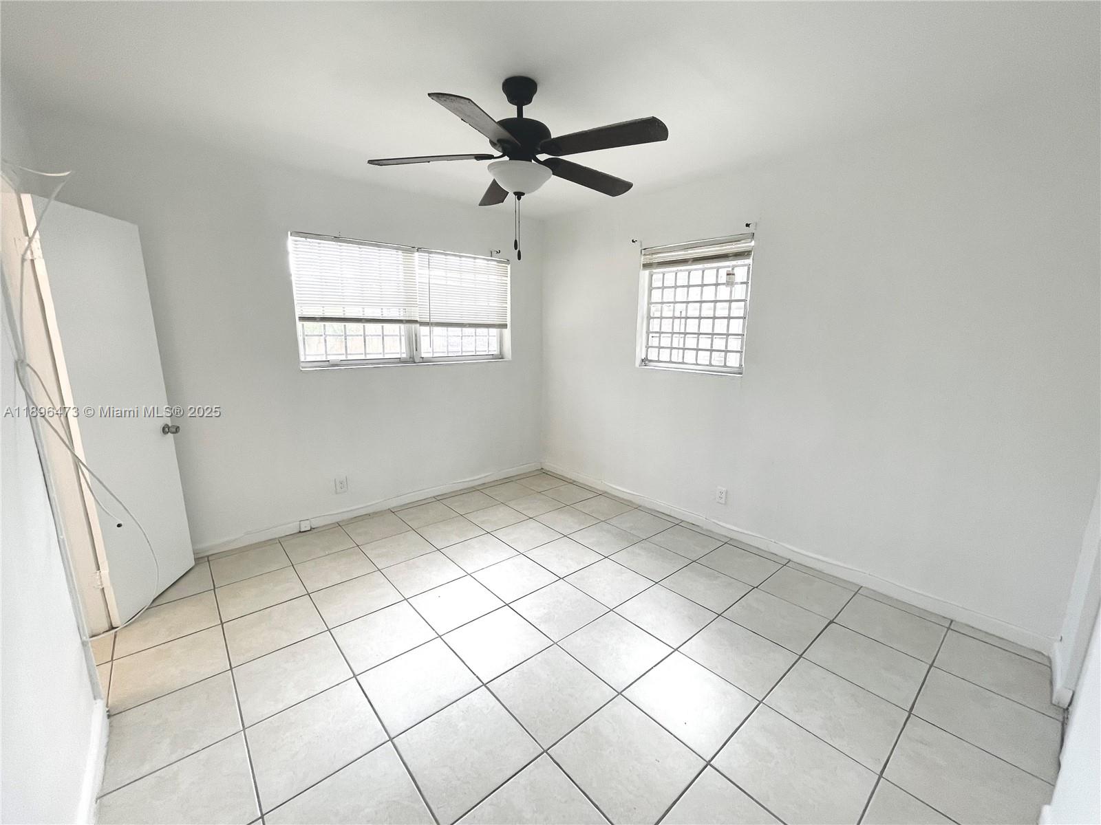 825 Northwest 9th Street, Unit 825 Hallandale Beach, FL 33009 - Photo 11 of 18 a view of an empty room