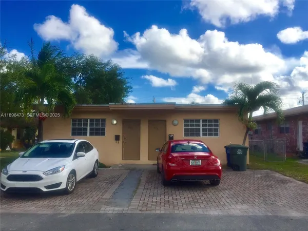 a car parked in front of a house