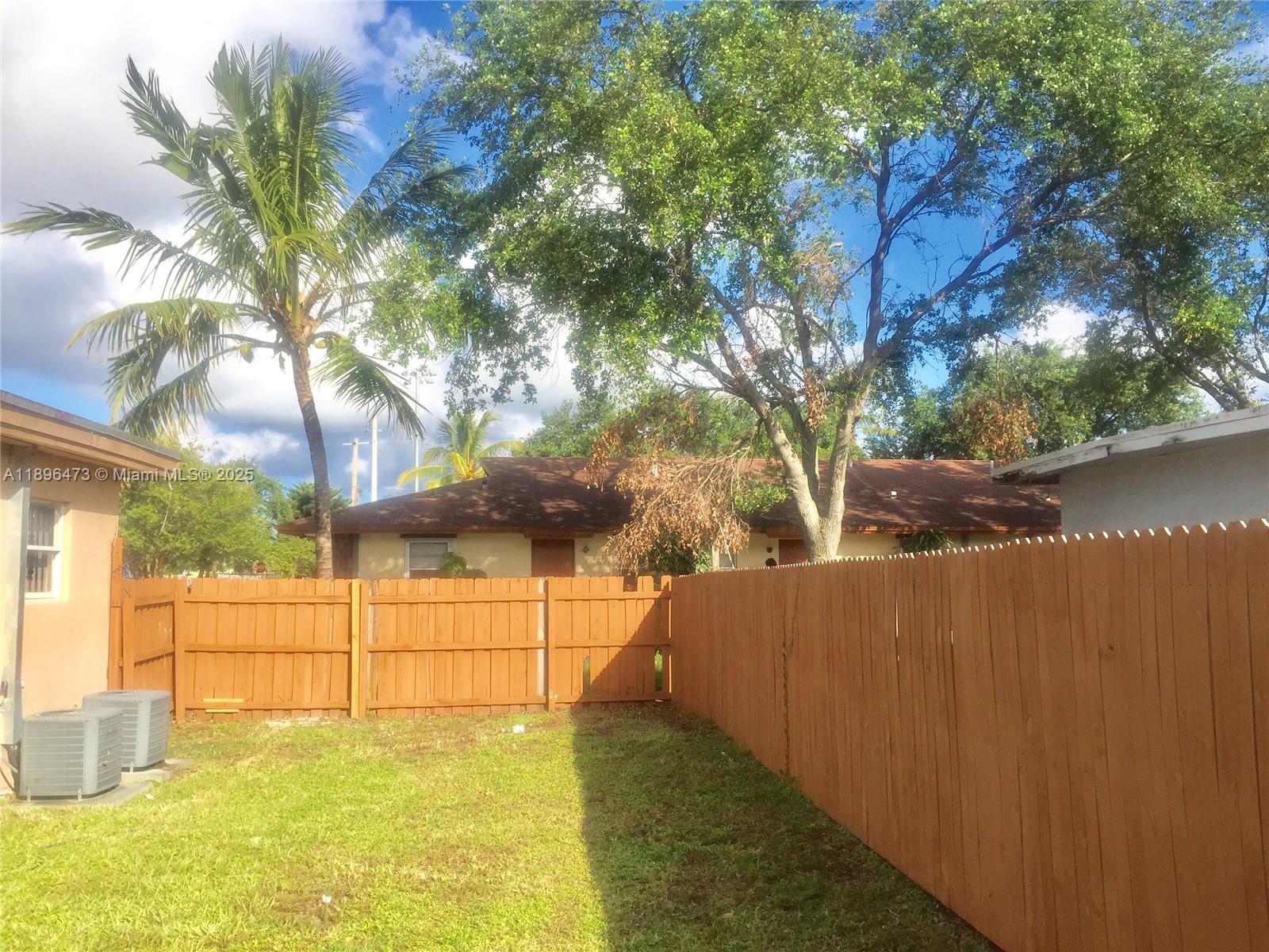 825 Northwest 9th Street, Unit 825 Hallandale Beach, FL 33009 - Photo 3 of 18 a view of a backyard