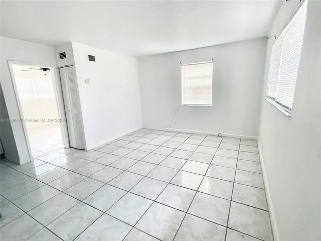 a view of an empty room and window