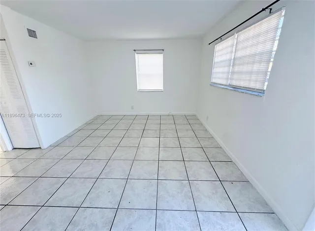 a view of an empty room and window