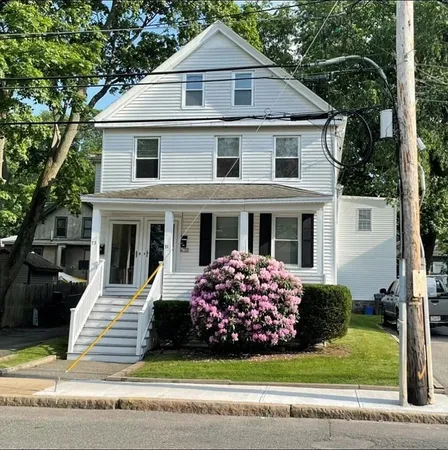 a view of a house with a yard