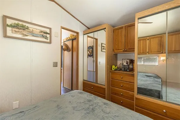 a bedroom with bed and window