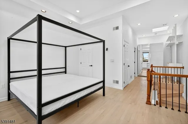 a view of a room with furniture and windows