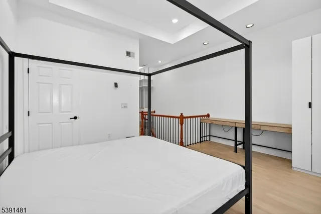 a bedroom with furniture and a window