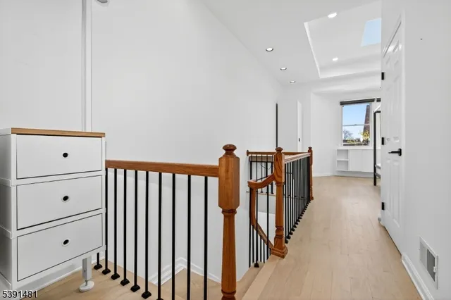 a view of a hallway with seating area
