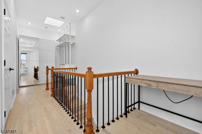 159 Palisade Avenue, Unit 2R Jersey City, NJ 07306 - Photo 20 of 26 a view of a hallway with seating area