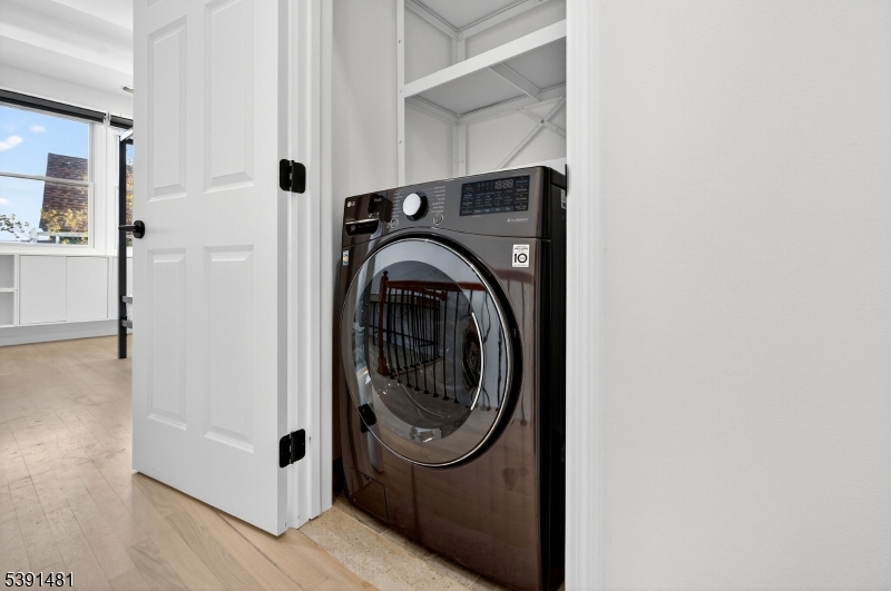 159 Palisade Avenue, Unit 2R Jersey City, NJ 07306 - Photo 23 of 26 a utility room with dryer and washer
