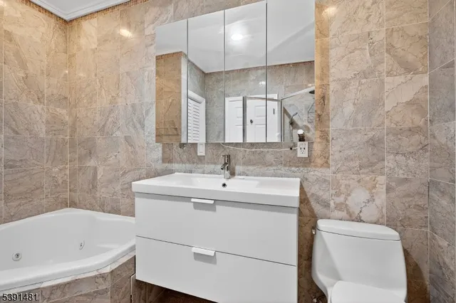 a picture of a bench in front of a wall