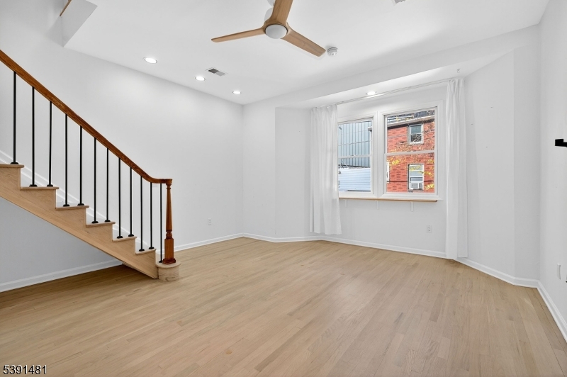 159 Palisade Avenue, Unit 2R Jersey City, NJ 07306 - Photo 7 of 26 a view of an entryway with wooden floor