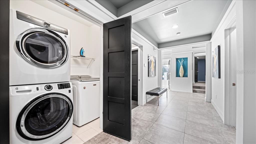 331 Muirfield Loop Reunion, FL 34747 - Photo 68 of 100 a view of a hallway with washer and dryer