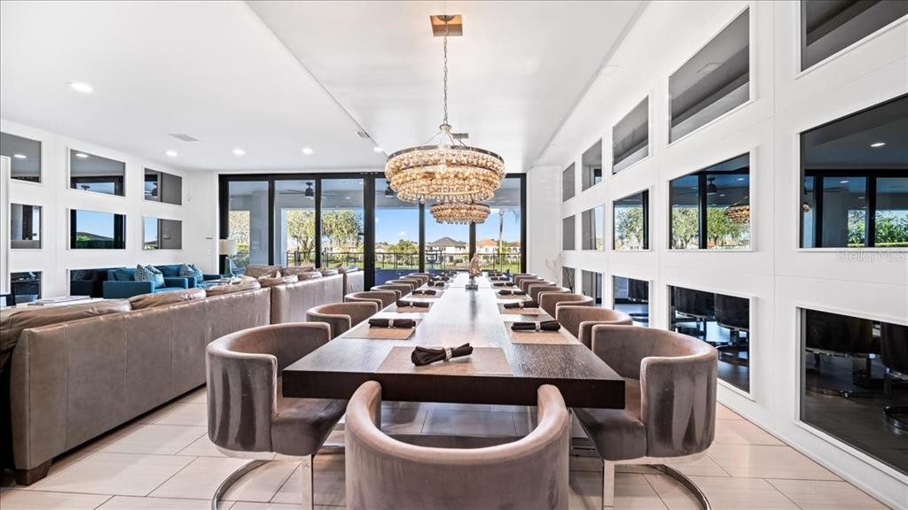 331 Muirfield Loop Reunion, FL 34747 - Photo 72 of 100 a view of a dining room with furniture window and wooden floor