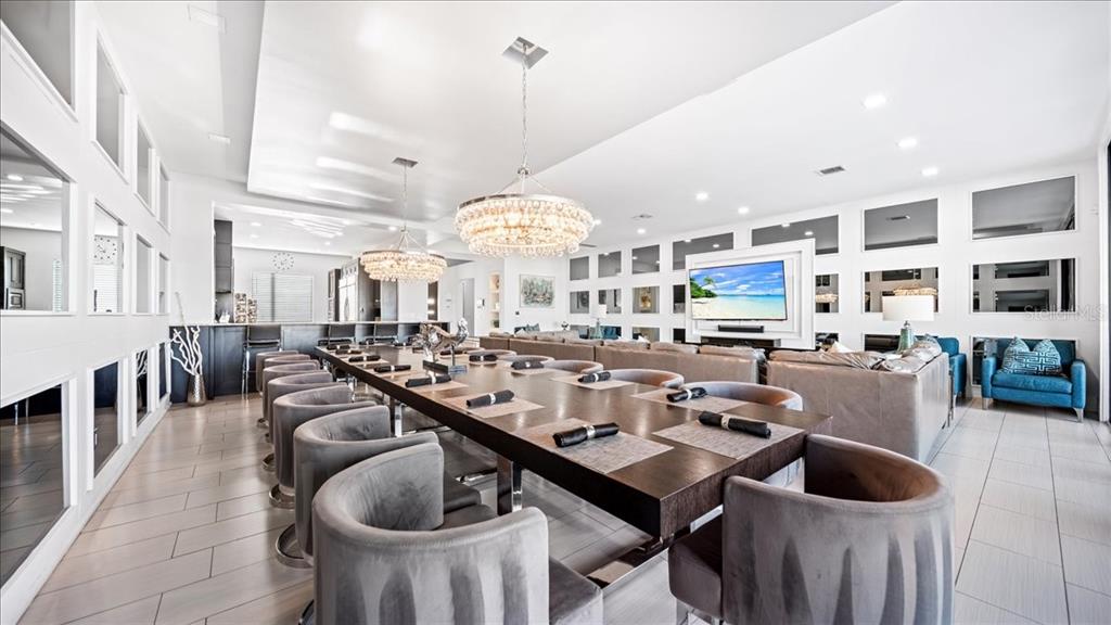 331 Muirfield Loop Reunion, FL 34747 - Photo 74 of 100 a very nice looking dining room with a large dining table and chairs