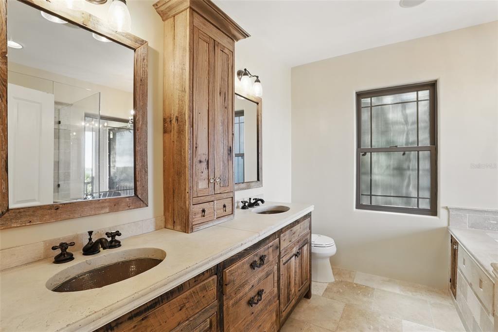 106 Victoria Street Merritt Island, FL 32952 - Photo 22 of 51 a bathroom with 2 sink and a mirror