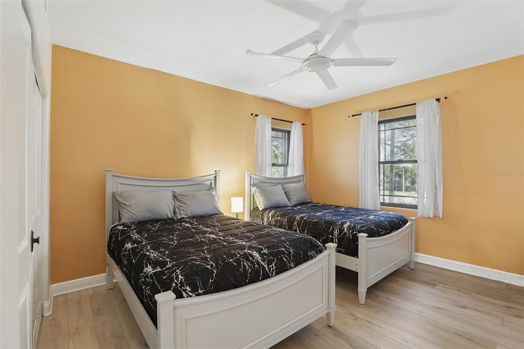 106 Victoria Street Merritt Island, FL 32952 - Photo 27 of 51 a bed room with a bed and a window
