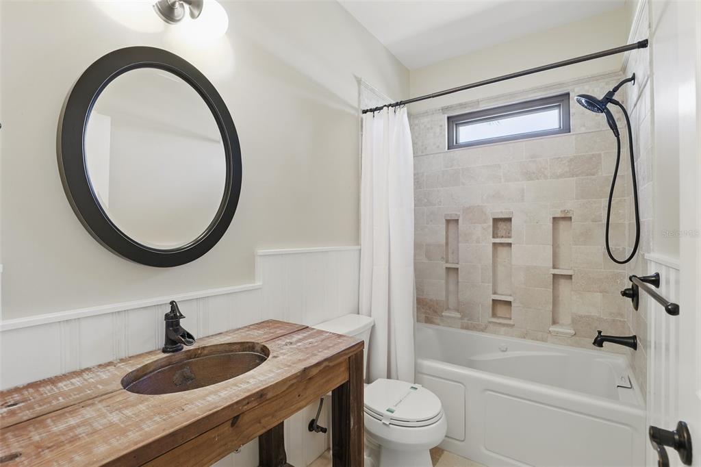 106 Victoria Street Merritt Island, FL 32952 - Photo 28 of 51 a bathroom with a granite countertop sink a mirror and a shower