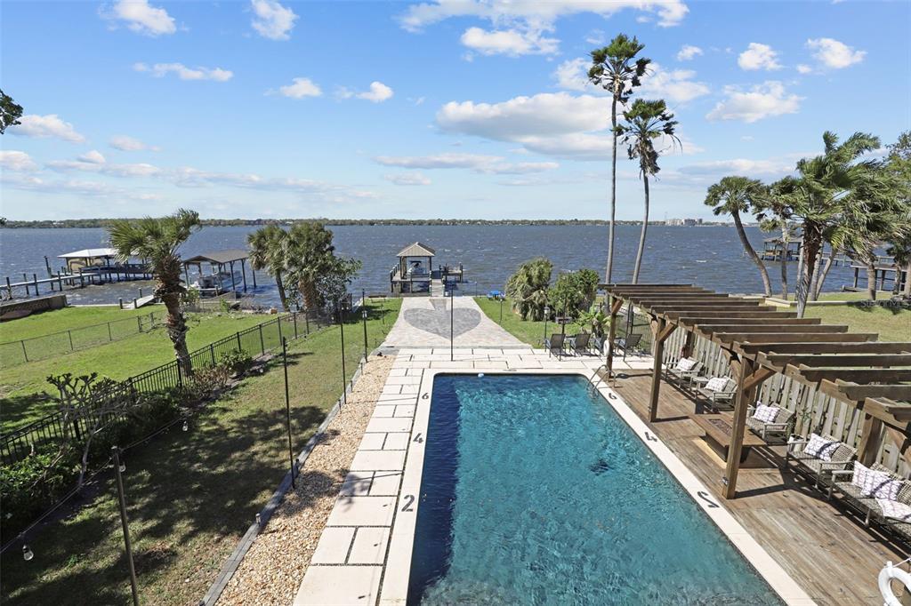 106 Victoria Street Merritt Island, FL 32952 - Photo 44 of 51 a view of a lake with couches in the patio