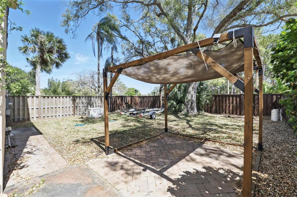 106 Victoria Street Merritt Island, FL 32952 - Photo 48 of 51 a view of a backyard with a tree