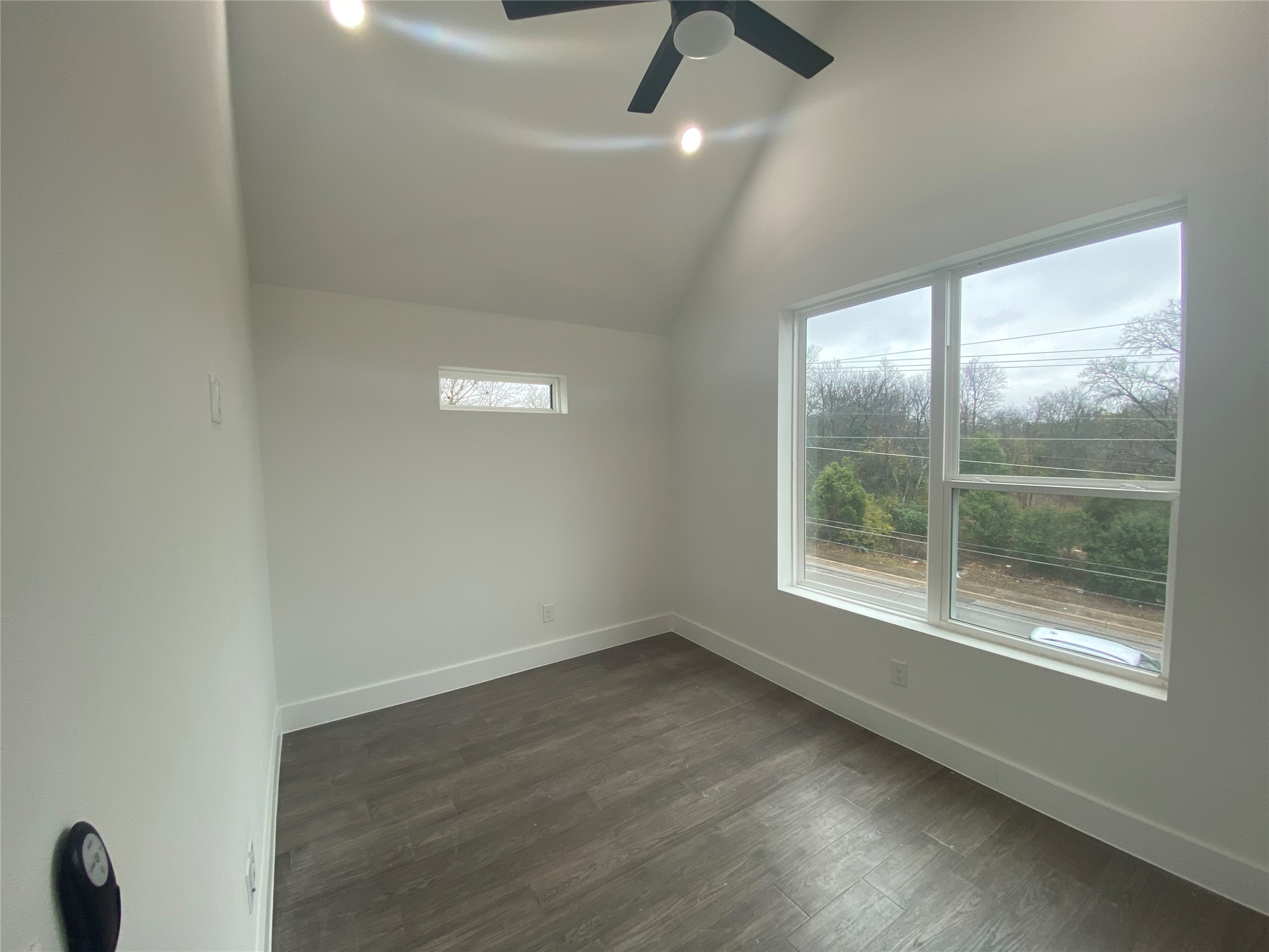 1916 Webberville Road, Unit B Austin, TX 78721 - Photo 3 of 25 Room featuring a vaulted ceiling with recessed lighting and a ceiling fan
