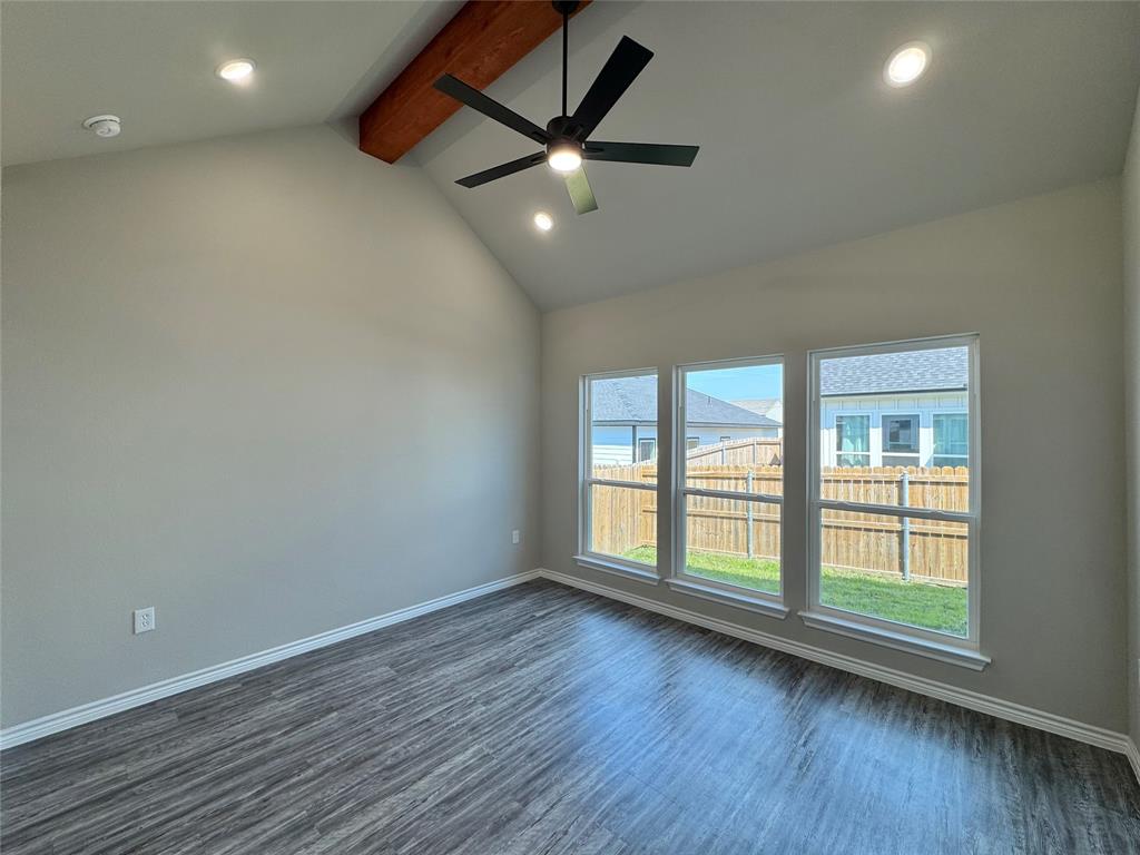 300 Rike Road Mabank, TX 75147 - Photo 7 of 18 an empty room with wooden floor and windows