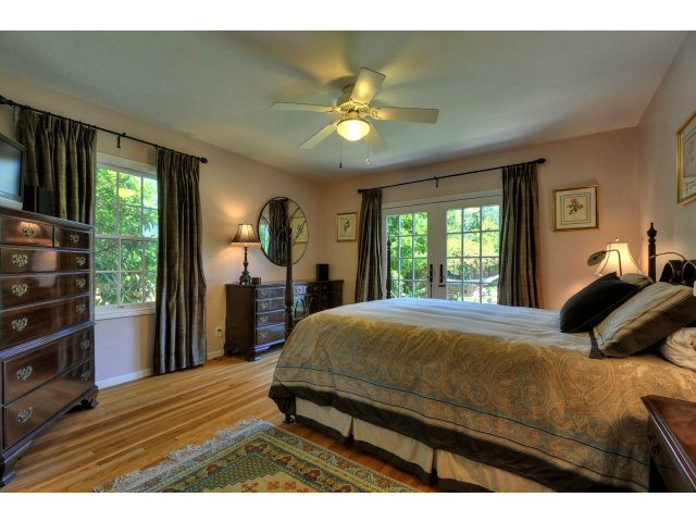 350 Velarde Street Mountain View, CA 94041 - Photo 16 of 24 a bedroom with a bed window and a flat tv screen