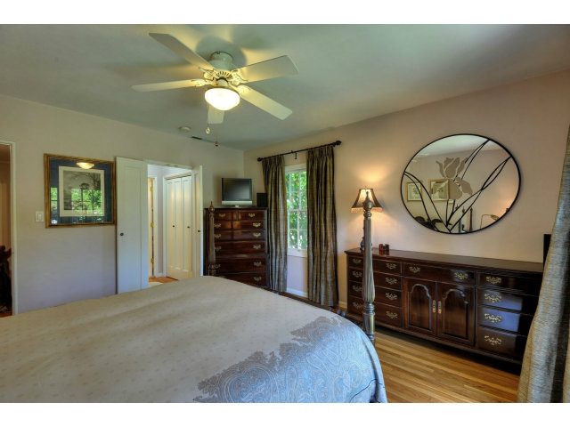 350 Velarde Street Mountain View, CA 94041 - Photo 17 of 24 a bedroom with a bed and a chandelier