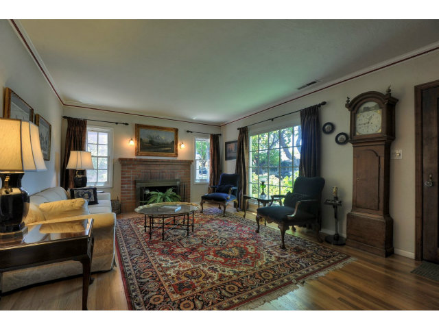 350 Velarde Street Mountain View, CA 94041 - Photo 3 of 24 a living room with furniture a window and a fireplace