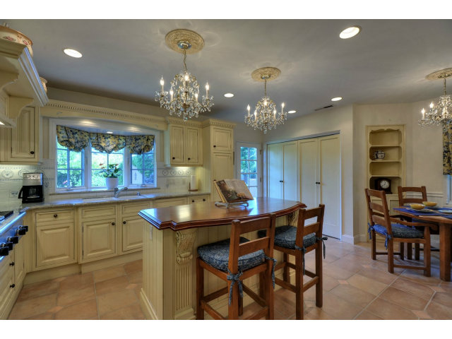 350 Velarde Street Mountain View, CA 94041 - Photo 9 of 24 a kitchen with a table and chairs in it