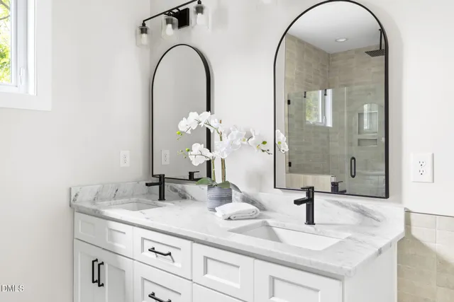 a bathroom with a shower and a sink