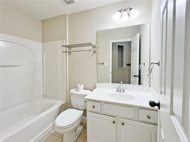 a view of a room with wooden floor and chandelier