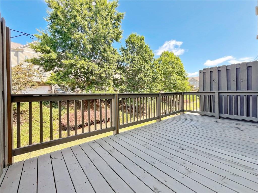525 Grove Field Court Northwest Suwanee, GA 30024 - Photo 21 of 57 a view of wooden balcony with outdoor space