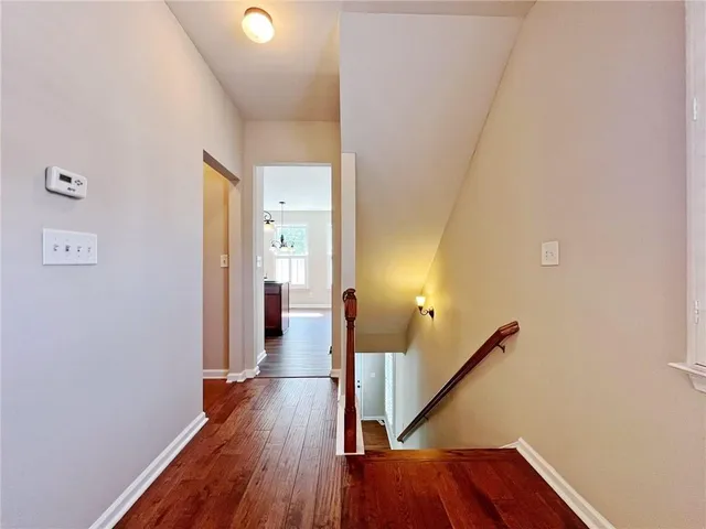 a kitchen with kitchen island granite countertop a sink a counter space appliances and cabinets