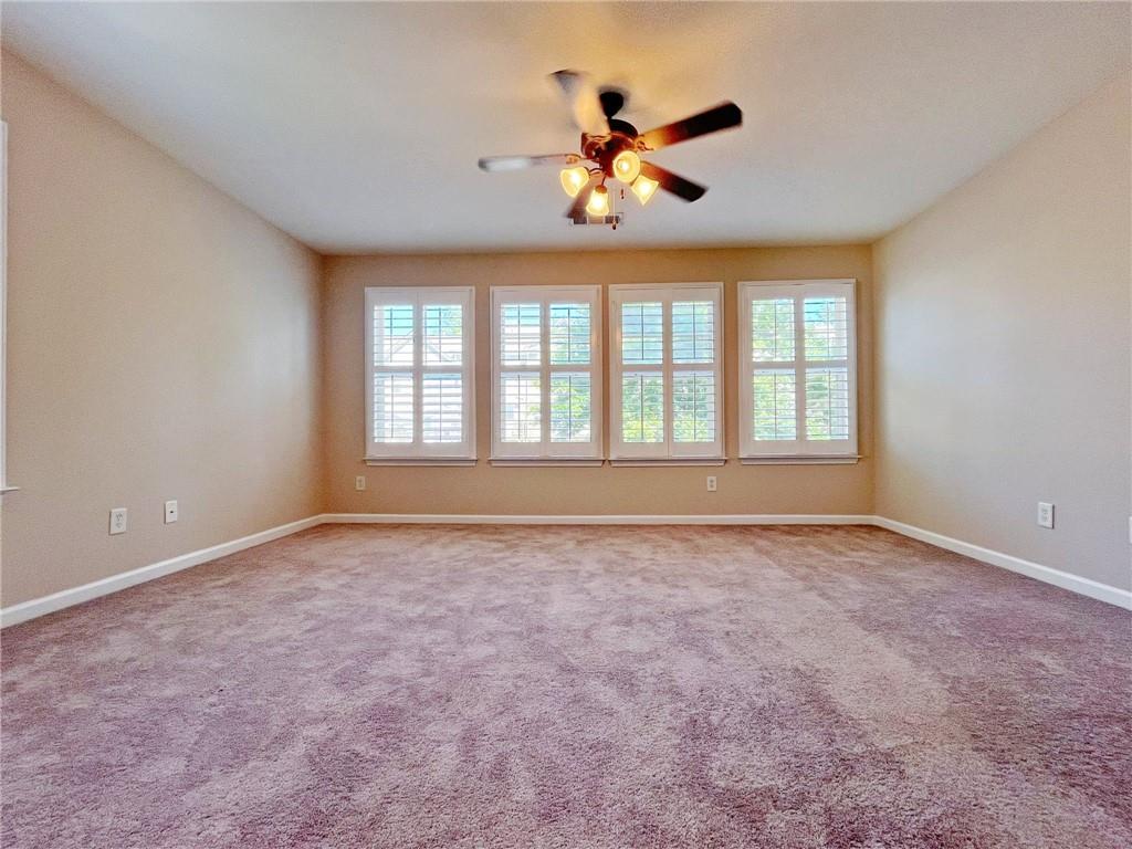 525 Grove Field Court Northwest Suwanee, GA 30024 - Photo 33 of 57 a view of an empty room with a window