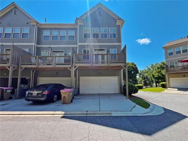 a view of yard with swimming pool and green space