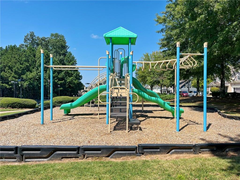 525 Grove Field Court Northwest Suwanee, GA 30024 - Photo 53 of 57 a view of a house with a park