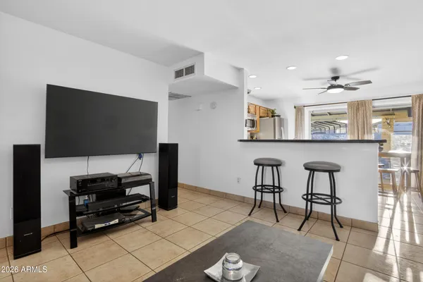 a view of livingroom with hardwood floor and ceiling fan