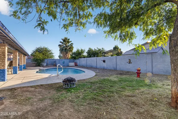 a front view of a house with yard porch and outdoor seating