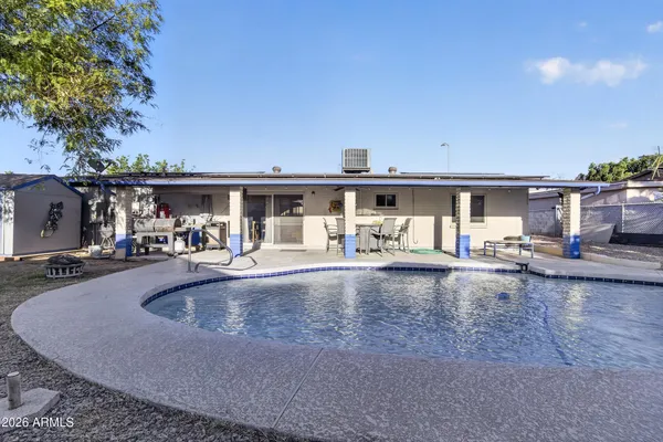 swimming pool view with a outdoor space