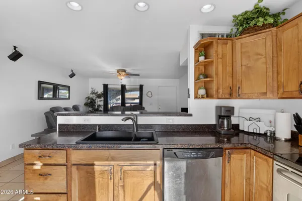 a kitchen with a sink and a refrigerator