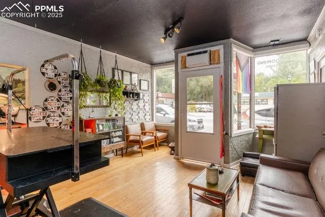 a living room with furniture and a chandelier
