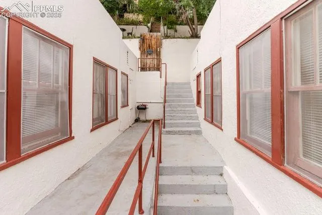 a room that has a bed and a table in it