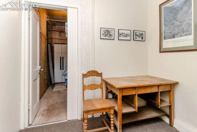 a car parked in front of a white house