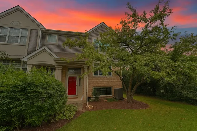 front view of a house with a yard