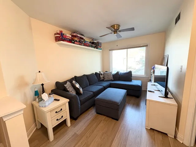 a bedroom with a bed and a desk