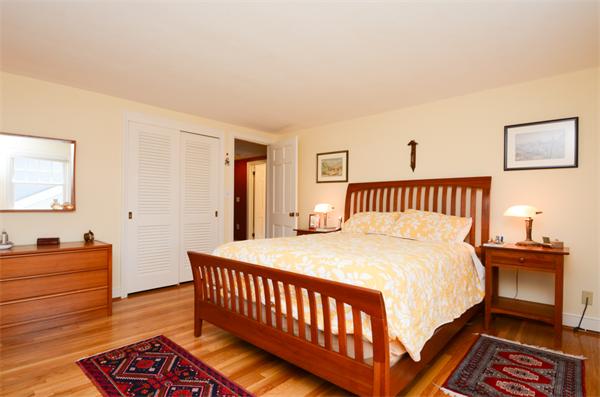 107 Viscount Road Longmeadow, MA 01106 - Photo 18 of 30 a bedroom with a bed and a lamp on dresser